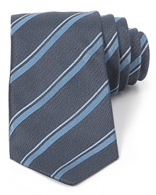 Lively up your look with a handsome skinny tie adorned with colorful stripes and cut in premium silk for an ultra-soft hand. Lively up your look with a handsome skinny tie adorned with colorful stripes and cut in premium silk for an ultra-soft hand.