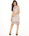 A rich crocheted lace texture and a hint of metallic shine give new life to a petite sheath silhouette from INC!