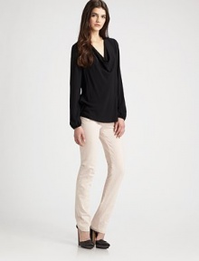 Long bishop sleeves accentuate this slightly slouched cowlneck. CowlneckLong bishop sleevesLong sleevesRibbed cuffsLonger length hits below the hipsRayonDry cleanImported of Italian fabric