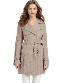 This essential layer exudes workweek chic with its double breasted front and gorgeous rumpled texture.Notched collar converts to point collar Concealed double breasted button-front Single gun flap Long buckled belt ties at front Vertical welt pockets Back rain shield Inverted center back pleat with button closure at hem Cotton lining About 32½ from shoulder to hem 66% nylon/34% cotton; dry clean Imported This essential layer exudes workweek chic with its double breasted front and gorgeous rumpled texture.Notched collar converts to point collar Concealed double breasted button-front Single gun flap Long buckled belt ties at front Vertical welt pockets Back rain shield Inverted center back pleat with button closure at hem Cotton lining About 32½ from shoulder to hem 66% nylon/34% cotton; dry clean Imported