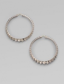 A classic hoop design in sterling silver, distinguished by a faceted zigzag pattern all around. Sterling silver Diameter, about 2½ Pierced Imported A classic hoop design in sterling silver, distinguished by a faceted zigzag pattern all around. Sterling silver Diameter, about 2½ Pierced Imported