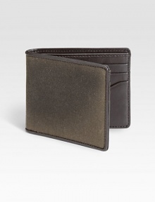 A classic water resistant fabric, waxwear acquires a beautiful patina with age and use. French-edged with leather, this bill holder mixes utilitarian and luxe materials to create a uniquely masculine wallet.One billfold compartmentSix card slotsWaxed cotton/leather4W x 4HImported A classic water resistant fabric, waxwear acquires a beautiful patina with age and use. French-edged with leather, this bill holder mixes utilitarian and luxe materials to create a uniquely masculine wallet.One billfold compartmentSix card slotsWaxed cotton/leather4W x 4HImported