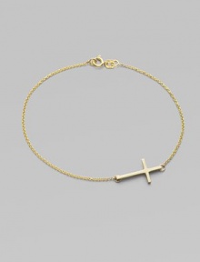 A gleaming 14k gold cross on a delicate chain.14k yellow gold Length, about 7 Pendant length, about ¾ Spring ring clasp Made in USA