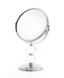 Definitely the fairest of them all, the double Crystal Ball mirror rotates 360 degrees to get every angle and, when you flip it over, magnify your beauty. A brilliant chrome finish and faceted detail add glamor to your daily routine. Definitely the fairest of them all, the double Crystal Ball mirror rotates 360 degrees to get every angle and, when you flip it over, magnify your beauty. A brilliant chrome finish and faceted detail add glamor to your daily routine.