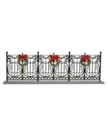 Arrange the Byers' Choice figurines in front of this faux wrought-iron fence. With traditional detail and pretty Christmas wreaths, it helps create a beautiful holiday scene. Arrange the Byers' Choice figurines in front of this faux wrought-iron fence. With traditional detail and pretty Christmas wreaths, it helps create a beautiful holiday scene.