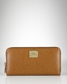 A slim and sleek zip-around wallet crafted in luxe textured leather from Lauren By Ralph Lauren. A slim and sleek zip-around wallet crafted in luxe textured leather from Lauren By Ralph Lauren.