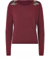 A simple, angora-wool pullover gets a hint of glamor with stylish embellishments on the shoulders - Upgraded must-have basic for the season - Silhouette features a narrow waist, round neck, long sleeves and a longer front than back - Wear with a pencil skirt, jeans or thick leggings and tall boots