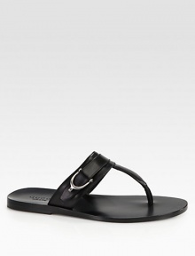 Leather thong sandal with silver palladium hardware.Stirrup detailLeather soleMade in Italy