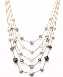 Try a fresh palette of color to brighten your look. This five-row illusion necklace by INC International Concepts combines plastic white beads, black glass beads, plastic fireballs, glass fireballs, white plastic beads, and frosted plastic beads. Set in gold tone mixed metal. Approximate length: 18 inches + 3-inch extender. Approximate drop: 3-1/2 inches. Try a fresh palette of color to brighten your look. This five-row illusion necklace by INC International Concepts combines plastic white beads, black glass beads, plastic fireballs, glass fireballs, white plastic beads, and frosted plastic beads. Set in gold tone mixed metal. Approximate length: 18 inches + 3-inch extender. Approximate drop: 3-1/2 inches.