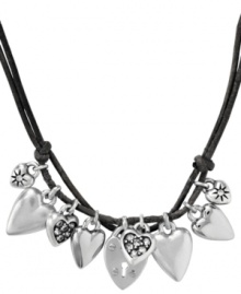 Appeal to the heart. Fossil's chic cluster necklace features a variety of heart charms in smooth silver tone mixed metal and some with sparkling crystal accents. Charms dangle from a doubled chocolate brown leather cord. Approximate length: 16 inches + 2-inch extender. Approximate drop: 5/8 inch. Appeal to the heart. Fossil's chic cluster necklace features a variety of heart charms in smooth silver tone mixed metal and some with sparkling crystal accents. Charms dangle from a doubled chocolate brown leather cord. Approximate length: 16 inches + 2-inch extender. Approximate drop: 5/8 inch.