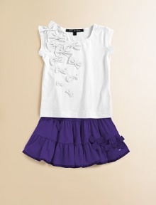 Pretty bows add character and style to this plush and cozy tee.U-neckShort cap sleeves92% cotton/8% elastaneMachine washImported Pretty bows add character and style to this plush and cozy tee.U-neckShort cap sleeves92% cotton/8% elastaneMachine washImported
