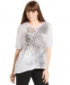 Lend pizzazz to your weekend look with Style&co.'s printed plus size top, finished by a high-low hem.