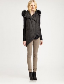 From the HELMUT capsule collection. Classic puffer vest has a raccoon fur-trimmed hood and contemporary, asymmetrical hem. Attached hood with dyed raccoon fur trimSleevelessAsymmetrical front zipperSlash pocketsAsymmetrical hi-lo hemAbout 25 from shoulder to hemPolyamideDry cleanImported of Italian fabricFur origin: FinlandModel shown is 5'10 (177cm) wearing US size Small. From the HELMUT capsule collection. Classic puffer vest has a raccoon fur-trimmed hood and contemporary, asymmetrical hem. Attached hood with dyed raccoon fur trimSleevelessAsymmetrical front zipperSlash pocketsAsymmetrical hi-lo hemAbout 25 from shoulder to hemPolyamideDry cleanImported of Italian fabricFur origin: FinlandModel shown is 5'10 (177cm) wearing US size Small.
