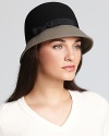 Take the colorblocking trend to the top with August Accessories' cloche, featuring a contrast brim and ribbon detail.