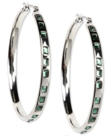 Be the talk of the party. These Nine West earrings feature a classic hoop silhouette embellished with plastic erinite stones. Finished with a click-top closure. Crafted in imitation rhodium mixed metal. Approximate diameter: 2 inches.