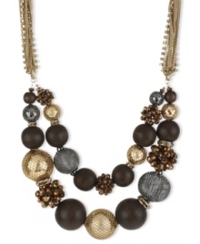 Strings and heavy metal. This frontal necklace from Kenneth Cole New York features a two-row design with hematite and gold tone wire-wrapped beads, bronze faceted fireball beads and brown wood beads. Crafted in gold tone mixed metal. Approximate length: 17 inches + 3-inch extender. Approximate drop: 2 inches.