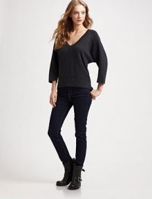 Three-quarter dolman sleeves and a hi-low hem enhance this oversized, wool-rich v-neck with a hint of cashmere. V-neck Three-quarter dolman sleeves Hi-low hem Longer length hits below the hips 40% wool/25% viscose/25% nylon/10% cashmere Dry clean Imported Three-quarter dolman sleeves and a hi-low hem enhance this oversized, wool-rich v-neck with a hint of cashmere. V-neck Three-quarter dolman sleeves Hi-low hem Longer length hits below the hips 40% wool/25% viscose/25% nylon/10% cashmere Dry clean Imported