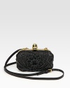 Tonal leather strips coil around this edgy leather bag, topped with a signature rhinestone skull clasp.Adjustable detachable shoulder strap, 22¾-24 dropClasp top closureLeather lining7W X 4H X 1¾DMade in Italy