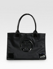 A lightweight, yet structured design accented in luxurious patent leather.Double patent leather top handles, 7 dropMagnetic snap closureOne inside zip pocketTwo inside open pocketsCotton lining13½W X 9½H X 4DImported A lightweight, yet structured design accented in luxurious patent leather.Double patent leather top handles, 7 dropMagnetic snap closureOne inside zip pocketTwo inside open pocketsCotton lining13½W X 9½H X 4DImported