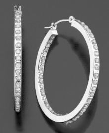 Dazzling diamond accents line these brilliant hoop earrings inside and out. Crafted in 14k white gold. Approximate diameter: 1 inch. Dazzling diamond accents line these brilliant hoop earrings inside and out. Crafted in 14k white gold. Approximate diameter: 1 inch.
