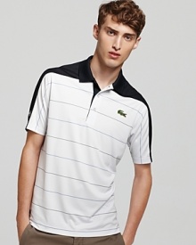 Get the court-ready look in a lightweight short sleeve striped polo with a thick contrasting stripe across the shoulders. Get the court-ready look in a lightweight short sleeve striped polo with a thick contrasting stripe across the shoulders.