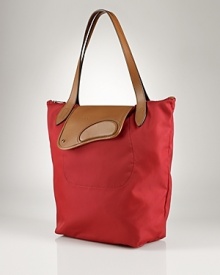 A durable design, Lauren by Ralph Lauren's leather-trimmed tote is a chic investment. Wear it with cashmere, denim and your favorite flats to reap the daytime dividends.