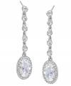 Stunning sparklers! Combining an oval shape with a linear silhouette, Carolee's dazzling crystal drop earrings are a fabulous finishing touch for your evening ensemble. Set in silver tone mixed metal. Approximate drop: 2-1/4 inches.