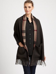 Reverses from solid to a bold check pattern with fringe trim on luxurious cashmere.Cashmere74 X 15Dry cleanImported Reverses from solid to a bold check pattern with fringe trim on luxurious cashmere.Cashmere74 X 15Dry cleanImported