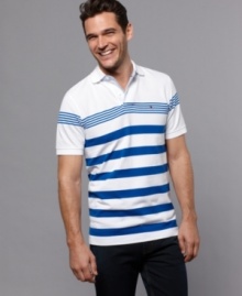 Always a classic. With a lean, linear look, this slim-fit polo from Tommy Hilfiger redefines your weekend wardrobe. Always a classic. With a lean, linear look, this slim-fit polo from Tommy Hilfiger redefines your weekend wardrobe.