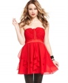 Get voted best dressed! XOXO's red-hot frock anchors a super-structured, paneled bodice with a skirt of airy ruffles.