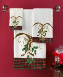 Delight and dazzle this season with the Lenox Holiday Nouveau fingertip towel, featuring a traditional holiday plaid and holly embellished with glittery gold accents. Delight and dazzle this season with the Lenox Holiday Nouveau fingertip towel, featuring a traditional holiday plaid and holly embellished with glittery gold accents.