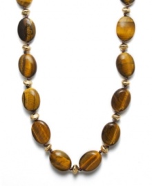 Perfect your summer look in neutral tones. Lauren by Ralph Lauren necklace features oval-shaped, semi-precious tiger's eye beads (18-24 mm). Spacers and clasp crafted in antique gold tone mixed metal. Approximate length: 30 inches.