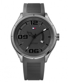 Stylish sport watch that will have you on trend while in the gym, by Tommy Hilfiger. Watch crafted of gray ribbed silicone strap and round stainless steel case. Gray dial features numerals at six, nine and twelve o'clock, applied stick indices, date window at four o'clock, three hands and iconic flag logo at twelve o'clock. Quartz movement. Water resistant to 50 meters. Ten-year limited warranty. Stylish sport watch that will have you on trend while in the gym, by Tommy Hilfiger. Watch crafted of gray ribbed silicone strap and round stainless steel case. Gray dial features numerals at six, nine and twelve o'clock, applied stick indices, date window at four o'clock, three hands and iconic flag logo at twelve o'clock. Quartz movement. Water resistant to 50 meters. Ten-year limited warranty.