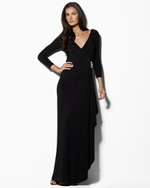 Effortlessly stunning in a glamorous floor-length silhouette with an elegant knot detail at the front, this gown is rendered in light, airy matte jersey for graceful movement. Effortlessly stunning in a glamorous floor-length silhouette with an elegant knot detail at the front, this gown is rendered in light, airy matte jersey for graceful movement.