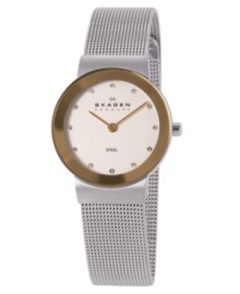 Classic Skagen Denmark style with subtle shine. This gorgeous bracelet features a stainless steel mesh bracelet and round case. Goldtone bezel. White dial with logo and Swarovski crystal accents at markers. Quartz movement. Water resistant to 30 meters. Limited lifetime warranty. Classic Skagen Denmark style with subtle shine. This gorgeous bracelet features a stainless steel mesh bracelet and round case. Goldtone bezel. White dial with logo and Swarovski crystal accents at markers. Quartz movement. Water resistant to 30 meters. Limited lifetime warranty.