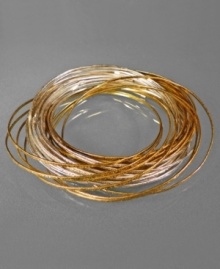 Make a jangling beat with this cluster of rich dual-toned bangle bracelets, from Jessica Simpson. In two-toned mixed metal. Each measures approximately 2-1/2 inches in diameter.