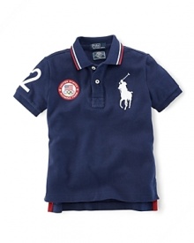 A preppy short-sleeved polo shirt in breathable cotton mesh is accented with London embroidery and a US Olympic Team embroidered emblem, celebrating Team USA's participation in the 2012 Olympics. A preppy short-sleeved polo shirt in breathable cotton mesh is accented with London embroidery and a US Olympic Team embroidered emblem, celebrating Team USA's participation in the 2012 Olympics.