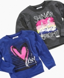 Make her style shine in this cozy and warm sweatshirt top from DKNY, featuring a fun graphic on front. Make her style shine in this cozy and warm sweatshirt top from DKNY, featuring a fun graphic on front.