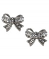 Tie together your new look. These chic Betsey Johnson earrings feature flirty bows with crystal accents, set in silver tone mixed metal. Approximate drop: 5/8 inch.