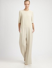 This silky, wide-legged one-piece silhouette has an elegant, fluid sensibility.Jewel necklineElbow-length sleevesFront welt pocketSide slash pocketsConcealed back zipInseam, about 3089% wool/9% cotton/2% polyesterDry cleanMade in Italy of imported fabricModel shown is 5'11 (180cm) wearing US size 4. This silky, wide-legged one-piece silhouette has an elegant, fluid sensibility.Jewel necklineElbow-length sleevesFront welt pocketSide slash pocketsConcealed back zipInseam, about 3089% wool/9% cotton/2% polyesterDry cleanMade in Italy of imported fabricModel shown is 5'11 (180cm) wearing US size 4.