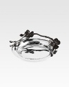 Form and function unite in this sophisticated wine coaster, inspired by the delicate beauty of orchid blossoms and crafted by one of the country's great metalwork artisans. From the Black Orchid CollectionNickel-plated metal/stainless steelAbout 6¼ diam.Wipe cleanImported 
