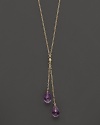 Twin amethyst briolettes sparkle from this 14K yellow gold lariat necklace.