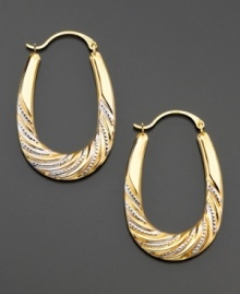 Simple things made very special. Pretty rhodium beads add a touch of whimsy to 14k yellow and white gold oval-hoop earrings. Drop measures 1-1/4 inches; diameter measures 3/4 inch. Simple things made very special. Pretty rhodium beads add a touch of whimsy to 14k yellow and white gold oval-hoop earrings. Drop measures 1-1/4 inches; diameter measures 3/4 inch.