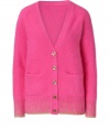 Super soft and cozy with a flattering tailored fit, Juicy Coutures bright pink angora-blend cardigan is a fun way to glam up your casual winter style - V-neckline, long sleeves, gold-toned metallic knit cuffs and trim, gold-toned button-down front, front slit pockets - Tailored fit - Wear with a tissue tee, favorite skinnies and flats