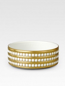 A beautiful serving bowl in fine Limoges porcelain, made entirely by hand and finished with individually-applied 14k gold pearl detail. From the Perlee Gold Collection Porcelain 1¾ X 5 diam. Dishwasher safe Imported 