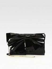 A chic, yet feminine style with a large coated canvas bow front.Detachable adjustable shoulder chain strap, 21½-22 dropMagnetic snap flap closureOne inside zip pocketTwo inside open pocketsSatin lining11¼W X 7H X 1¼DMade in Italy A chic, yet feminine style with a large coated canvas bow front.Detachable adjustable shoulder chain strap, 21½-22 dropMagnetic snap flap closureOne inside zip pocketTwo inside open pocketsSatin lining11¼W X 7H X 1¼DMade in Italy