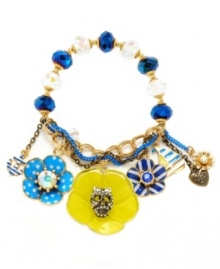 Step up your summer look with nautical-themed jewelry. Betsey Johnson's statement-making stretch bracelet features a blue chain, blue and clear cherry beads, a yellow enamel flower with a crystal-encrusted skull, blue and white enamel striped and polka-dotted flowers, a striped sailboat, and petite heart and flower charms. Set in antique gold-plated mixed metal. Approximate diameter: 2-1/4 inches. Step up your summer look with nautical-themed jewelry. Betsey Johnson's statement-making stretch bracelet features a blue chain, blue and clear cherry beads, a yellow enamel flower with a crystal-encrusted skull, blue and white enamel striped and polka-dotted flowers, a striped sailboat, and petite heart and flower charms. Set in antique gold-plated mixed metal. Approximate diameter: 2-1/4 inches.