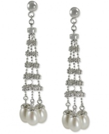 Show off your bold side. These drop earrings feature a stylish silhouette with cultured freshwater pearls (6-6-1/2 mm) adding an elegant touch. Crafted from sterling silver with a rhodium finish. Approximate drop length: 2-1/5 inches. Approximate drop width: 1/2 inch. Show off your bold side. These drop earrings feature a stylish silhouette with cultured freshwater pearls (6-6-1/2 mm) adding an elegant touch. Crafted from sterling silver with a rhodium finish. Approximate drop length: 2-1/5 inches. Approximate drop width: 1/2 inch.