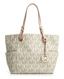 Make a signature statement this season with Michael Kors' chic logo print tote. Make a signature statement this season with Michael Kors' chic logo print tote.