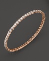Simply chic--single or stacked. Faceted diamonds set in gleaming 18K rose gold. By Roberto Coin.